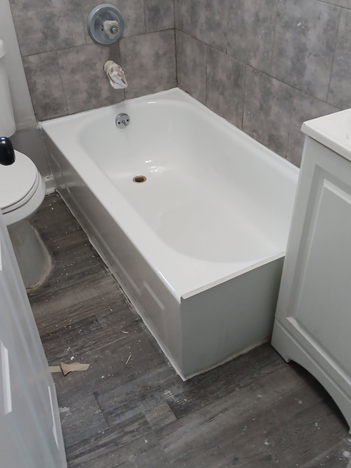Glossy white bathtub after refinishing